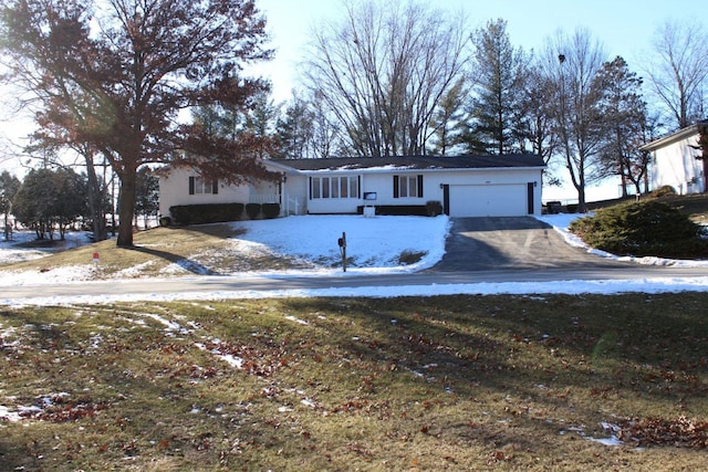 ranch-style home featuring a garage