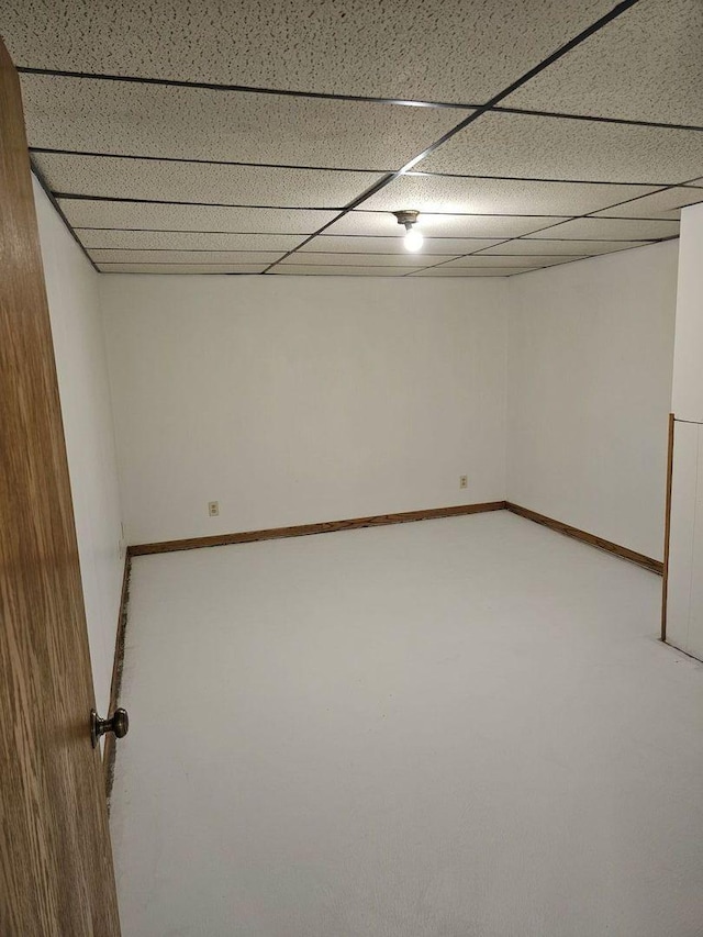 basement featuring a paneled ceiling