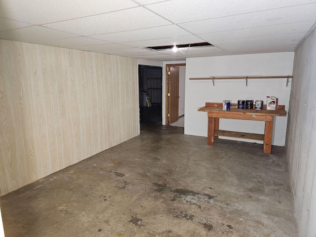 basement featuring a drop ceiling