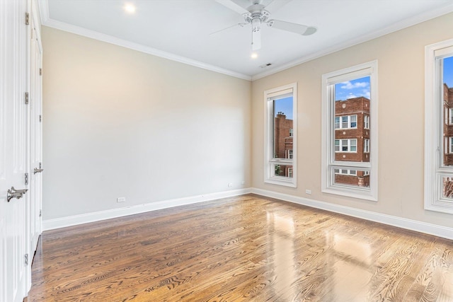 spare room featuring crown molding, hardwood / wood-style flooring, and ceiling fan