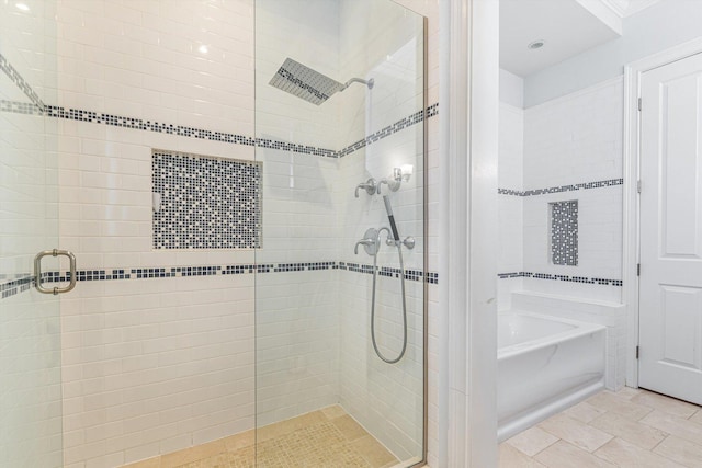 bathroom with shower with separate bathtub