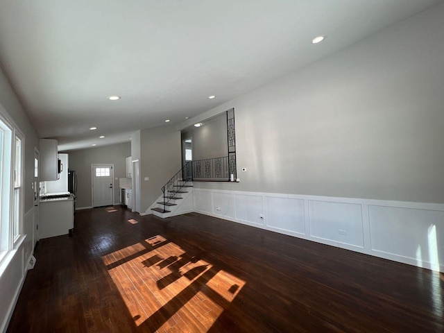 interior space with recessed lighting, wainscoting, stairs, and dark wood-style flooring