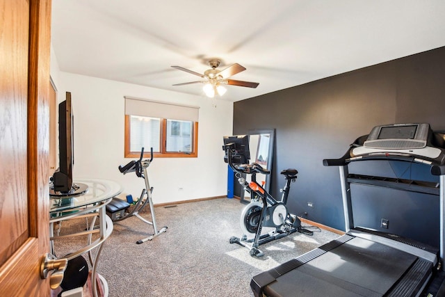 workout room featuring ceiling fan and carpet flooring