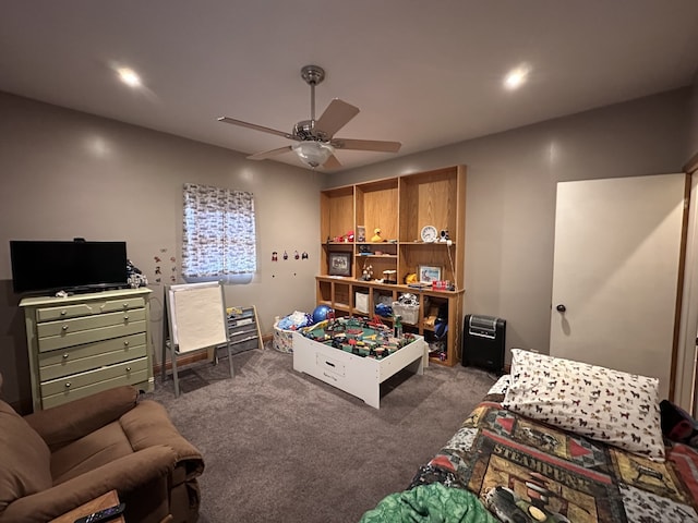 interior space featuring ceiling fan and dark colored carpet