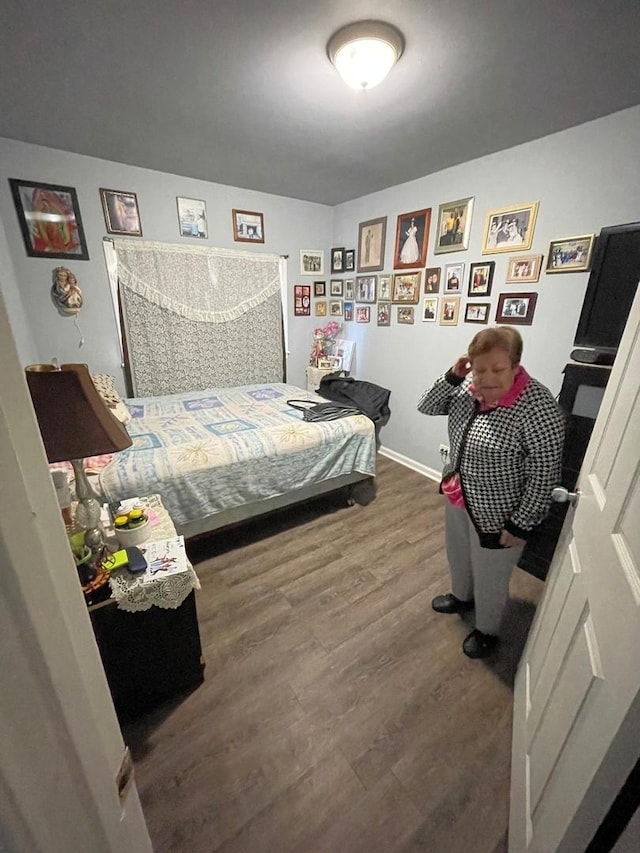 bedroom featuring dark hardwood / wood-style flooring