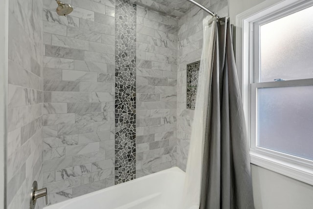 bathroom featuring shower / bath combo with shower curtain