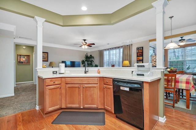 kitchen with hanging light fixtures, crown molding, black dishwasher, and ornate columns