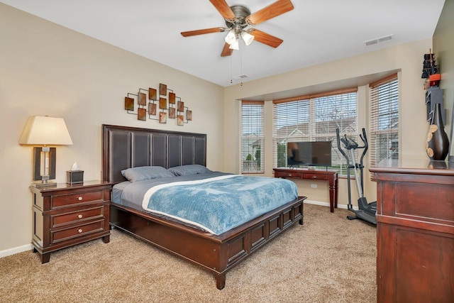 bedroom with ceiling fan and light colored carpet