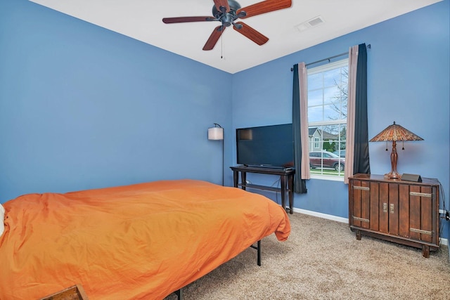 bedroom with ceiling fan and light colored carpet