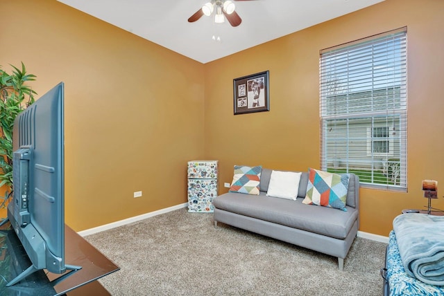 interior space with ceiling fan and carpet