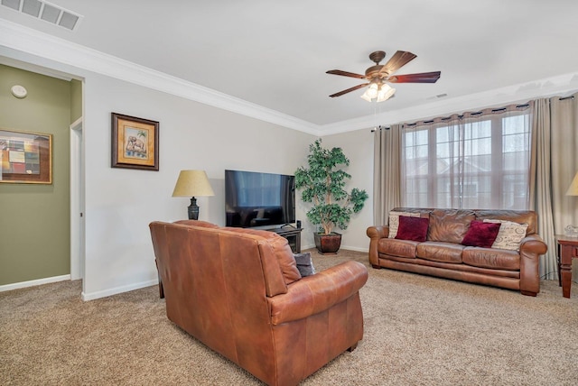 carpeted living room with crown molding and ceiling fan