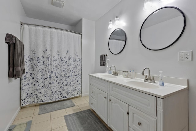 bathroom featuring tile patterned flooring and vanity