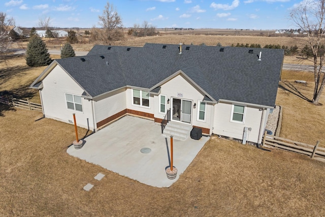 back of property featuring a patio and a lawn