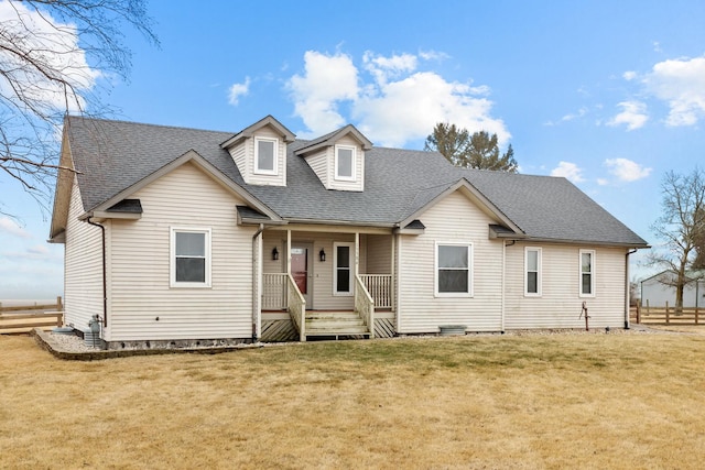 view of front of house with a porch and a front lawn