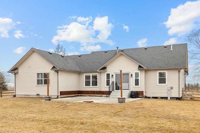 back of property featuring a yard and a patio area