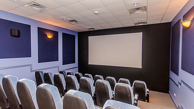 home theater with a drop ceiling and visible vents