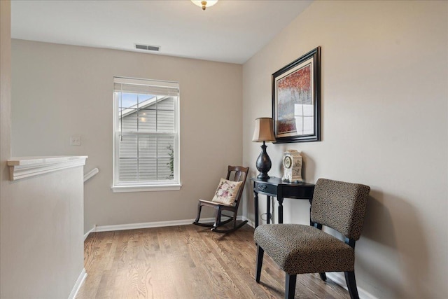 living area with light hardwood / wood-style flooring