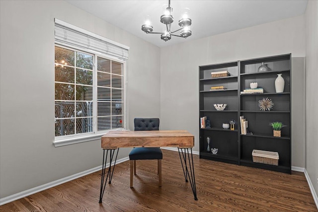 office featuring dark wood-type flooring and an inviting chandelier