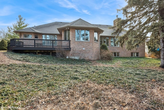 back of house with a yard and a deck