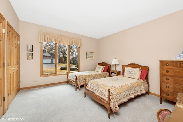 bedroom with light colored carpet