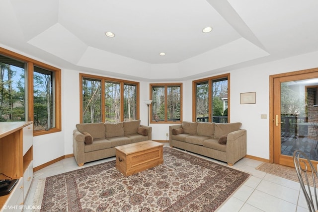 tiled living room with a raised ceiling