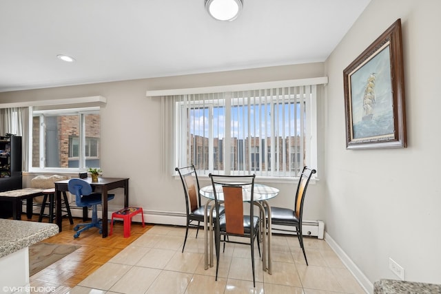 dining space with light parquet floors