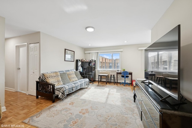 living room with parquet flooring and a baseboard radiator