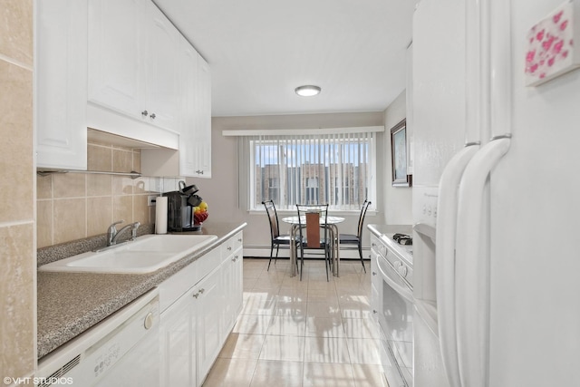 kitchen featuring sink, white appliances, white cabinetry, a baseboard heating unit, and decorative backsplash