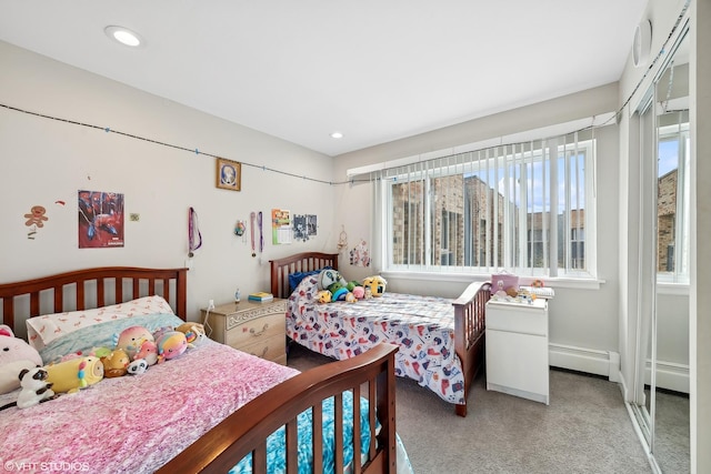 bedroom featuring a baseboard radiator and carpet