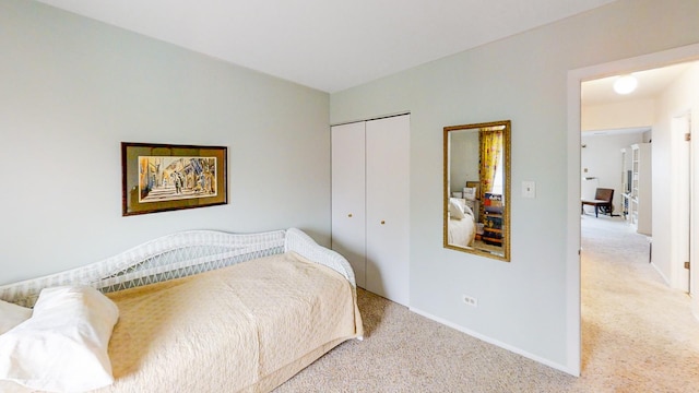 bedroom with carpet floors and a closet