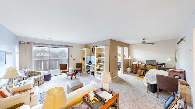 living room featuring light colored carpet and ceiling fan