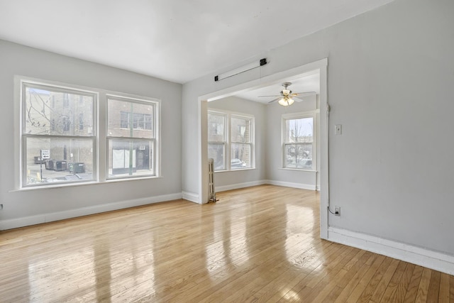 unfurnished room with light hardwood / wood-style flooring