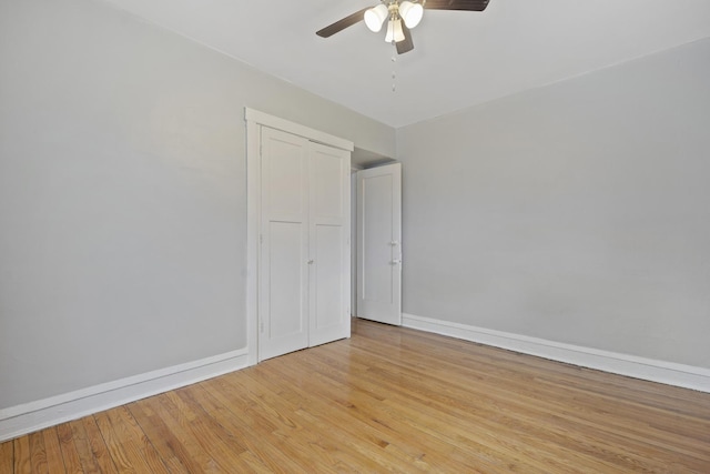 empty room featuring ceiling fan and light wood-type flooring