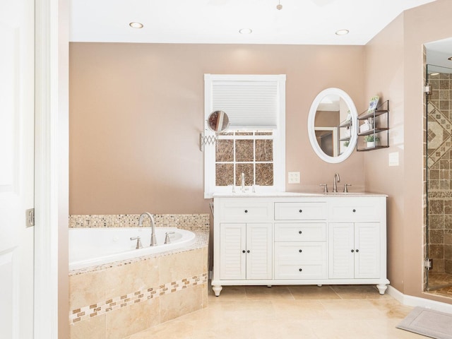 37W751 Orchard Ln, Elgin, IL 60124 - bathroom featuring a garden tub, tile patterned flooring, a tile shower, vanity, and recessed lighting