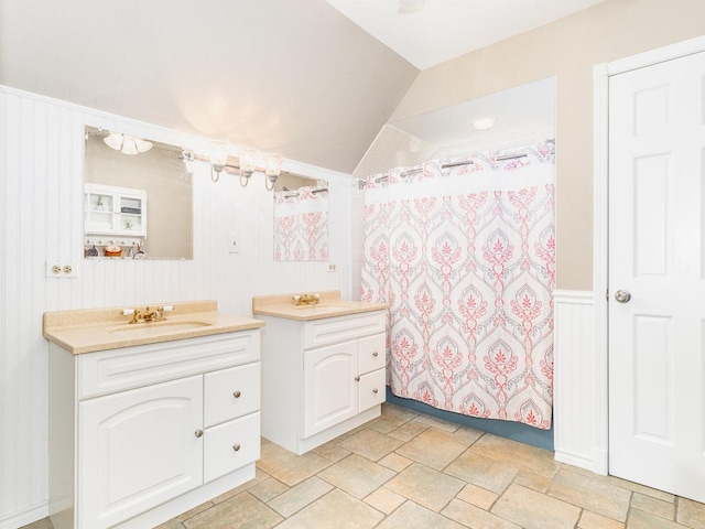 37W751 Orchard Ln, Elgin, IL 60124 - bathroom with vaulted ceiling, a shower with shower curtain, vanity, and stone tile floors