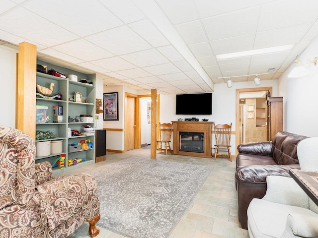37W751 Orchard Ln, Elgin, IL 60124 - living room featuring a drop ceiling, a fireplace, and baseboards