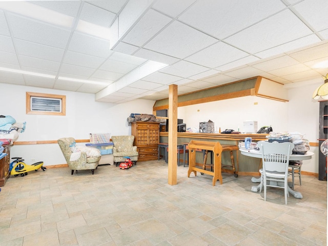 37W751 Orchard Ln, Elgin, IL 60124 - finished below grade area featuring a paneled ceiling, stone finish floor, and baseboards