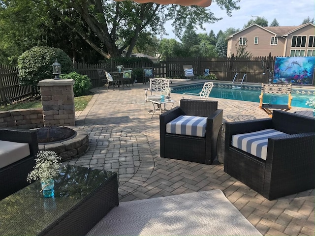 37W751 Orchard Ln, Elgin, IL 60124 - view of patio featuring an outdoor living space with a fire pit, a fenced backyard, and a fenced in pool