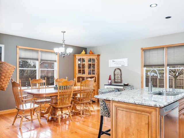 37W751 Orchard Ln, Elgin, IL 60124 - dining space featuring a chandelier, baseboards, and light wood-style floors