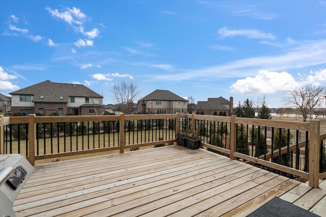 wooden deck with a lawn