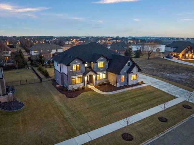 view of front of property with a yard