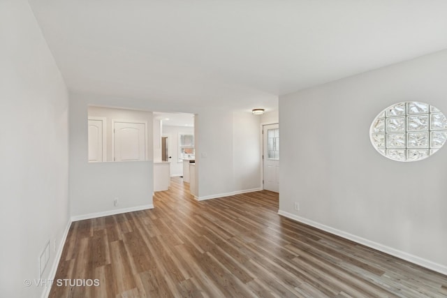 empty room with dark wood-type flooring