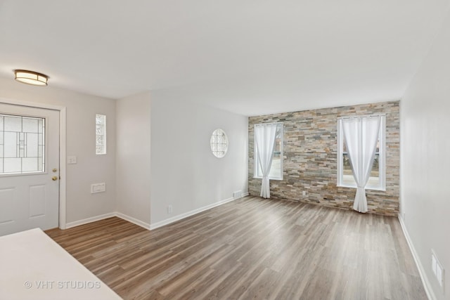 entryway featuring wood-type flooring and plenty of natural light