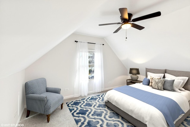 bedroom with lofted ceiling, ceiling fan, and carpet flooring