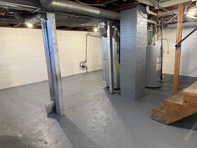 basement with gas water heater and heating unit