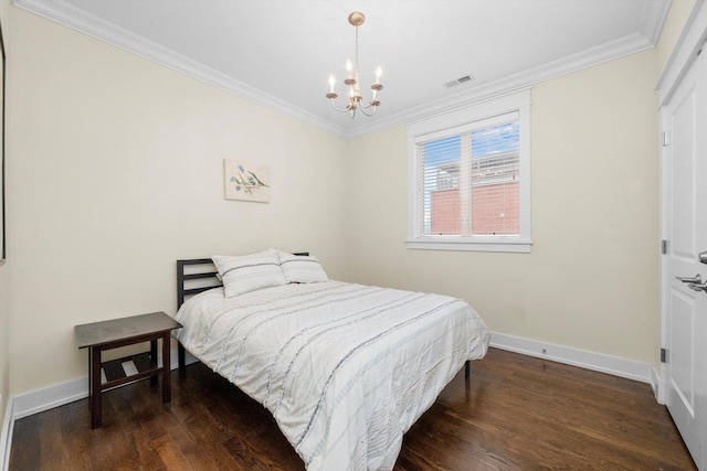 bedroom featuring ornamental molding, an inviting chandelier, and dark hardwood / wood-style flooring