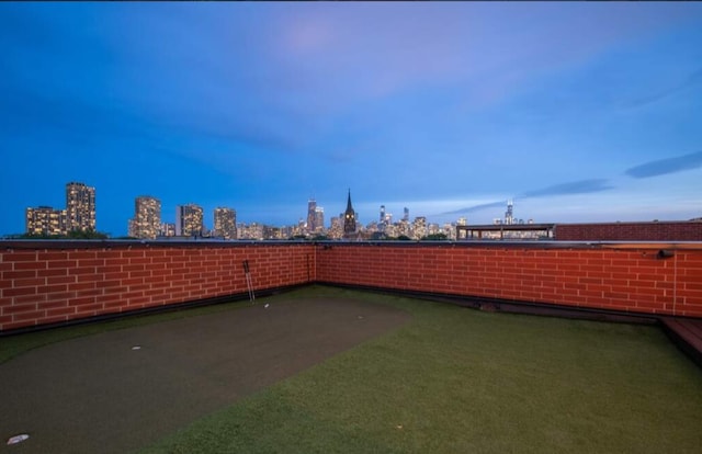 view of yard at dusk