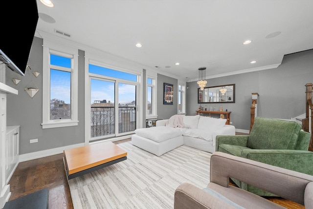 living room featuring crown molding and wood-type flooring