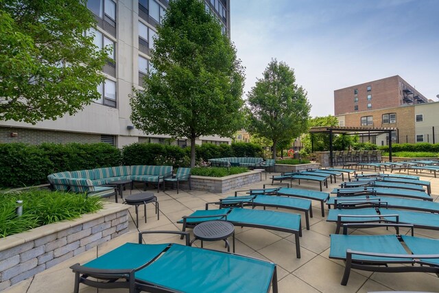 view of swimming pool featuring a pergola and a patio