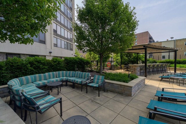 view of patio featuring an outdoor living space and a pergola